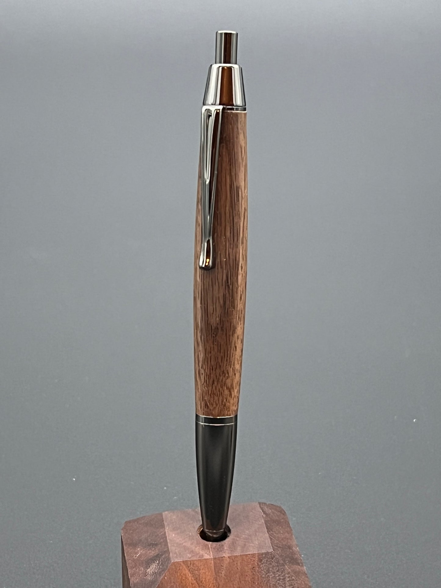 The Devin twist pen in Gunmetal finish with black walnut