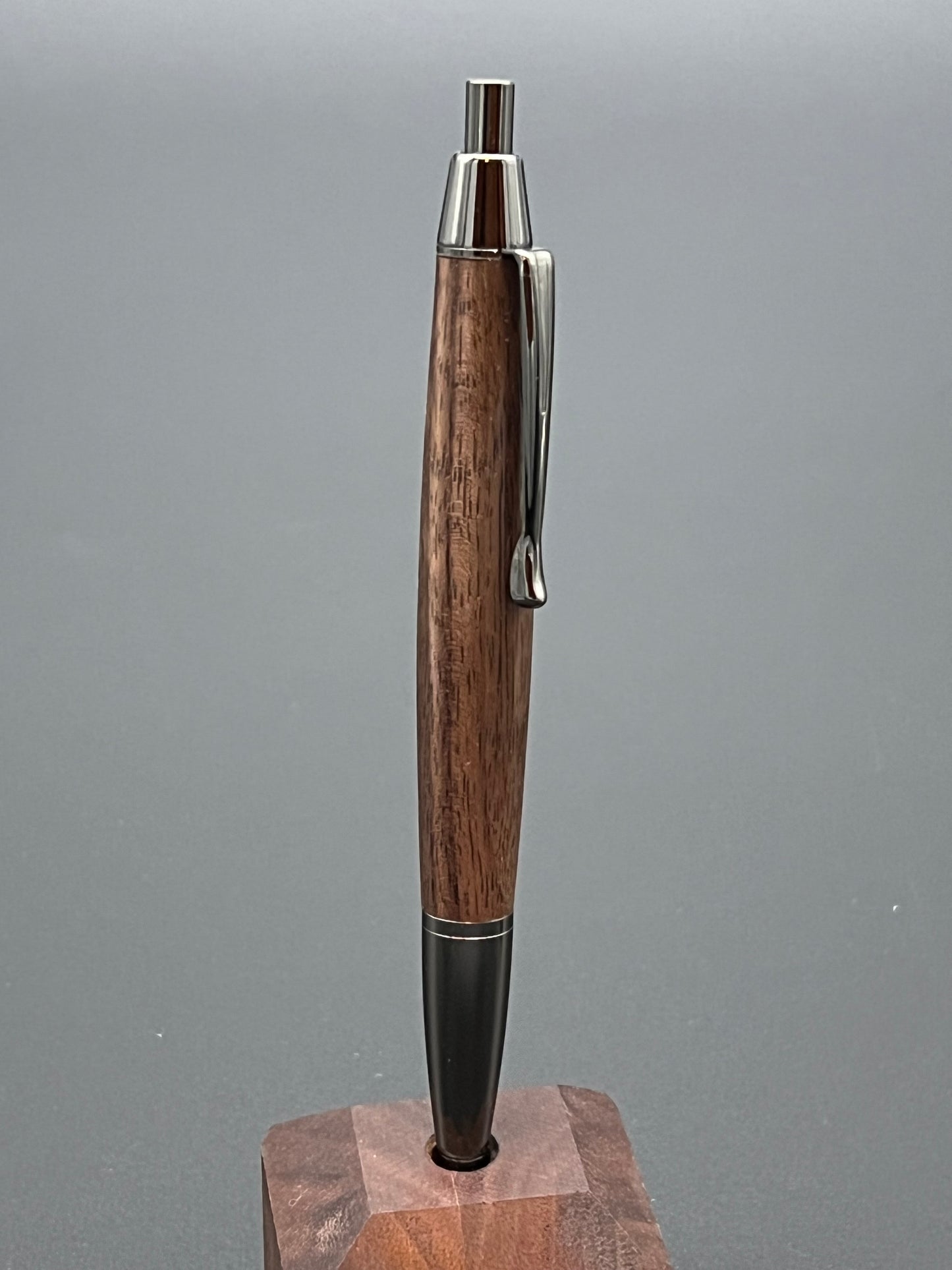 The Devin twist pen in Gunmetal finish with black walnut