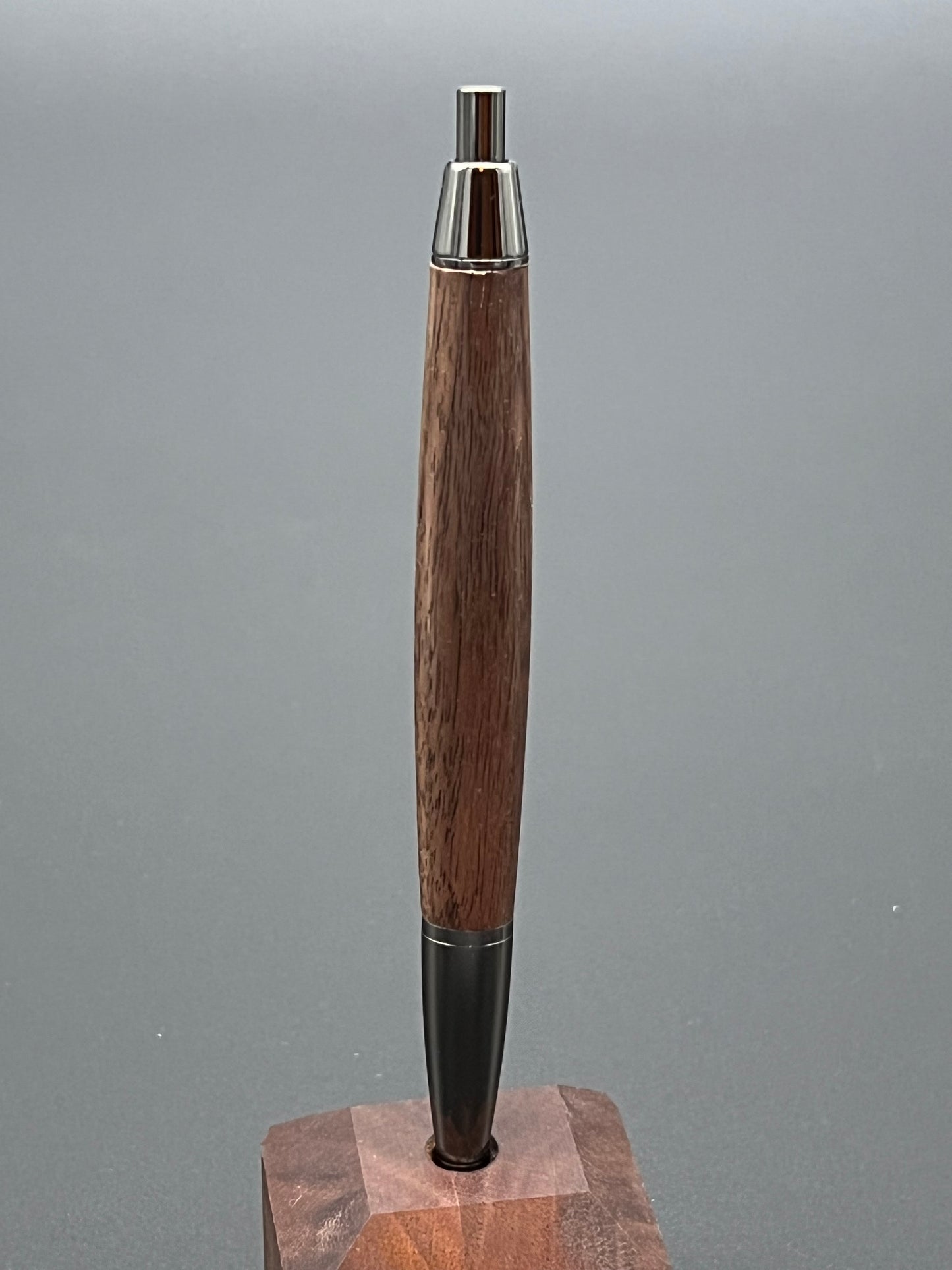 The Devin twist pen in Gunmetal finish with black walnut